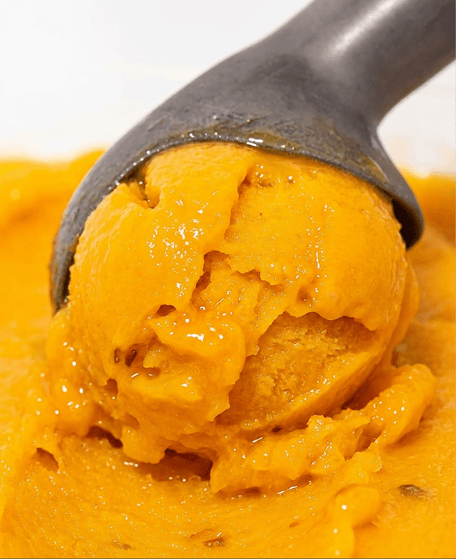 Mango sorbet being scooped